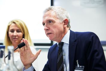 Daniel Beunza in foreground and Kate Coombs in background on panel discussion