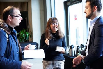 Economists networking over coffee