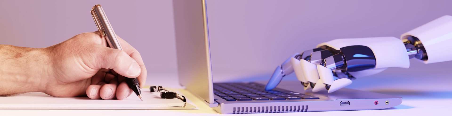 Robot hand writes on laptop while human hand writes on pad