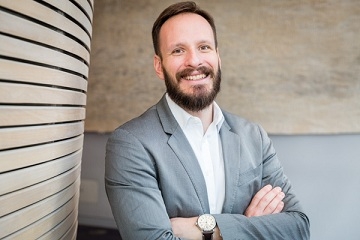 Profile photo of Professor Zachariadis, white male, dark hair, wearing a full beard and moustache